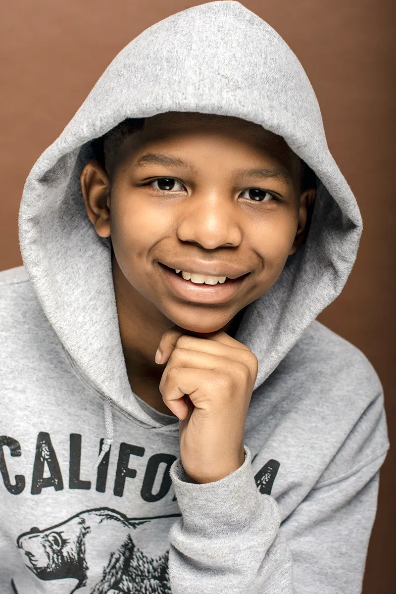 Professional headshot by SJRIMAGES – studio portrait with warm lighting